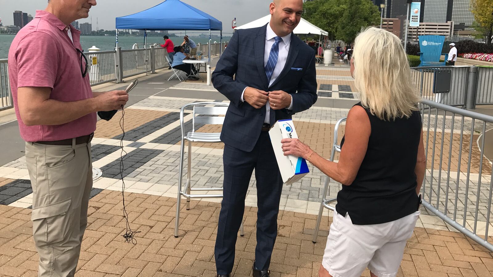 Detroit schools Superintendent Nikolai Vitti prepares for a TV interview on Detroit's RiverWalk in August 2017, before the start of his first school year at the helm of the district.
