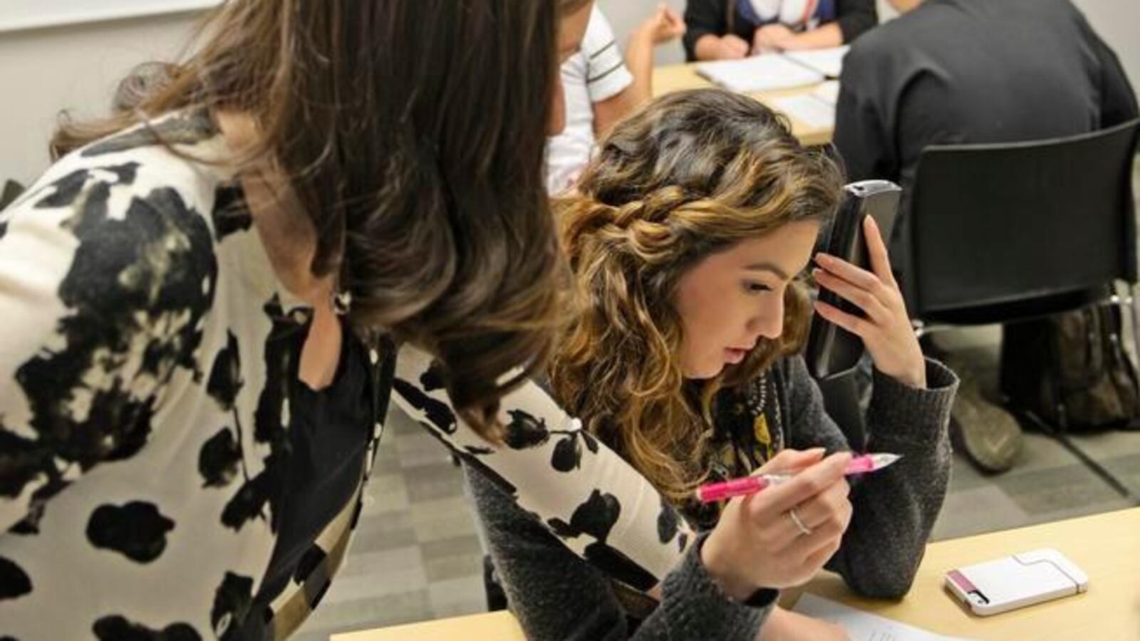 Math instructor Kellie Zolnikov, left, helps Kaitlin Carrasco, a student at Metro State University, during a math lab in 2014. Carrasco, 19, said she has always struggled in math, but scored high enough on her entrance exam to take the supplemental math lab she needs for a business management degree.